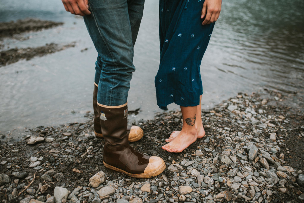 Photo of a couples feet, one wearing xtra tuffs the other barefoot