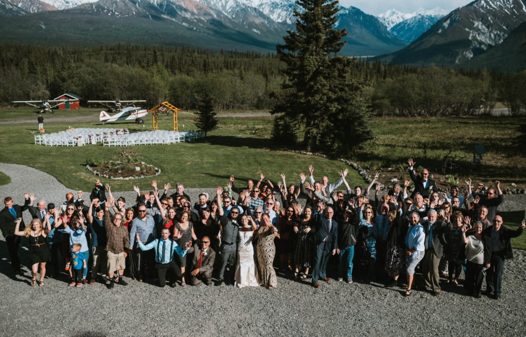 Entire guest list at wedding venue posed for photo