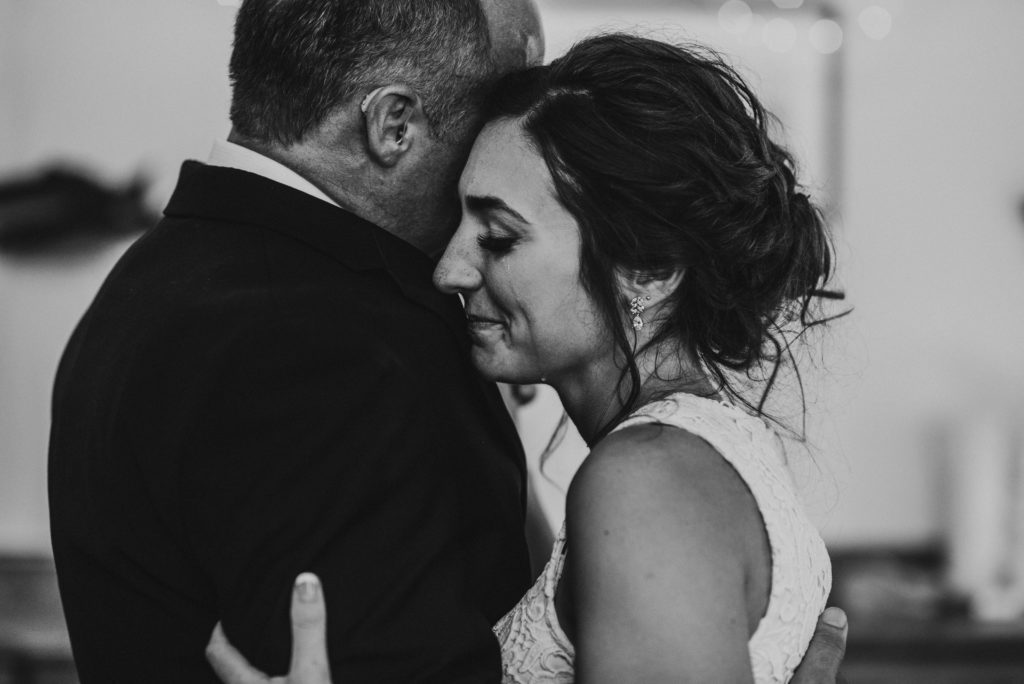Bride crying during father daughter dance