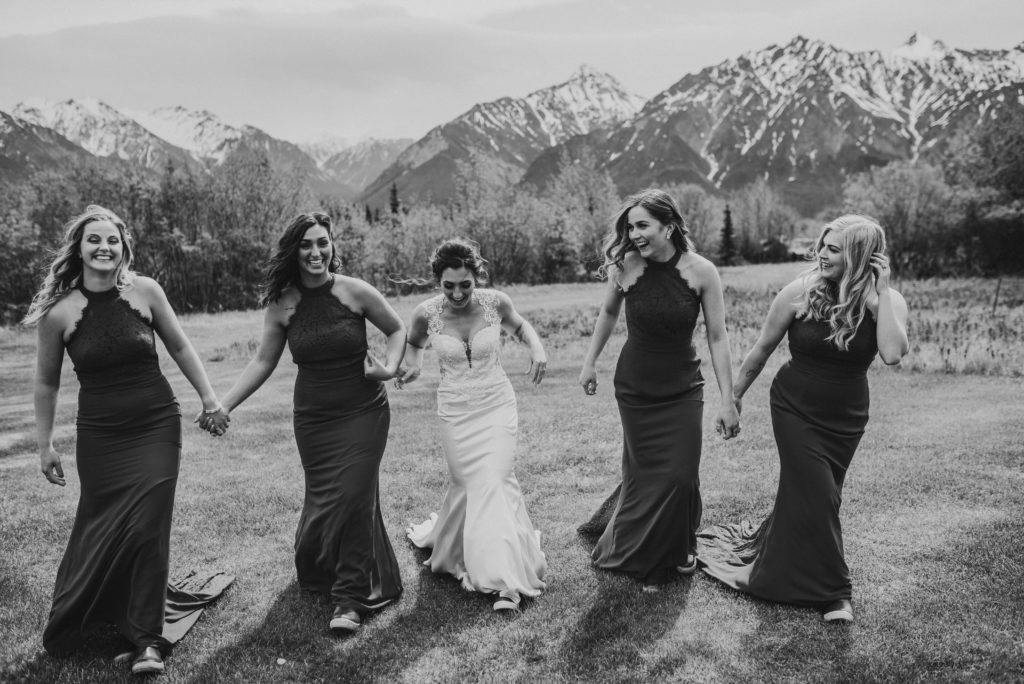bridesmaids in maroon dresses with mountain backdrop
