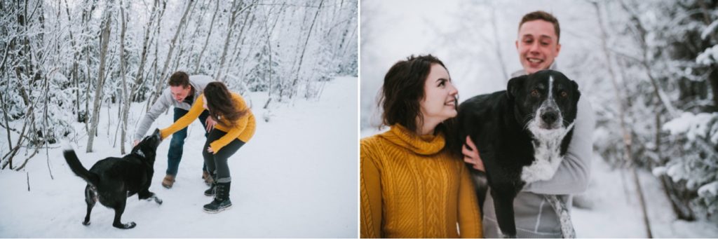 Couple playing with their dog in the winter during their engagement session