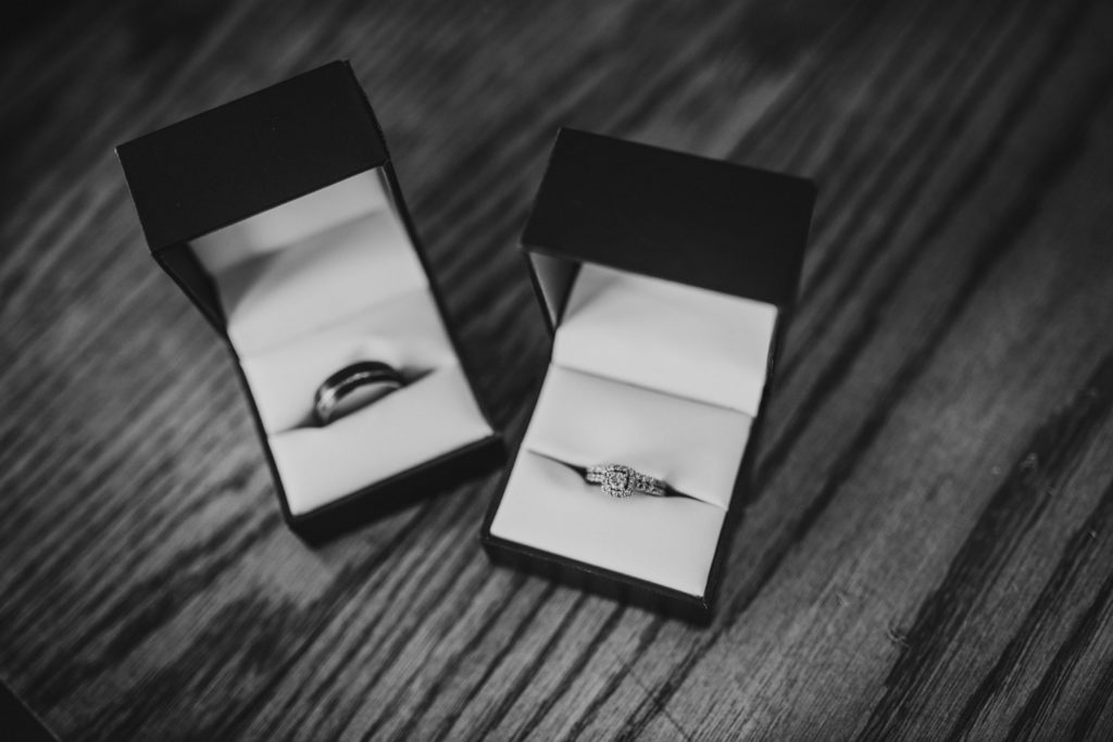 Black and white detail photo of the wedding rings