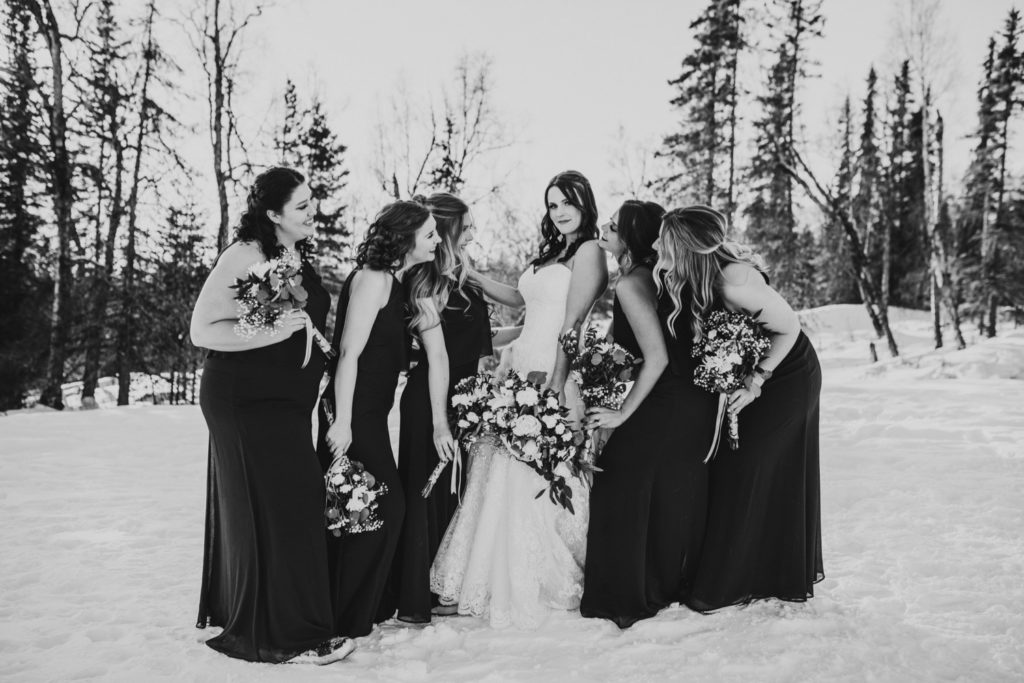 Black and white sassy photo of bridesmaids at Alaska winter wedding