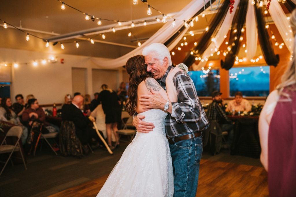 Bride and grand father dancing at wedding