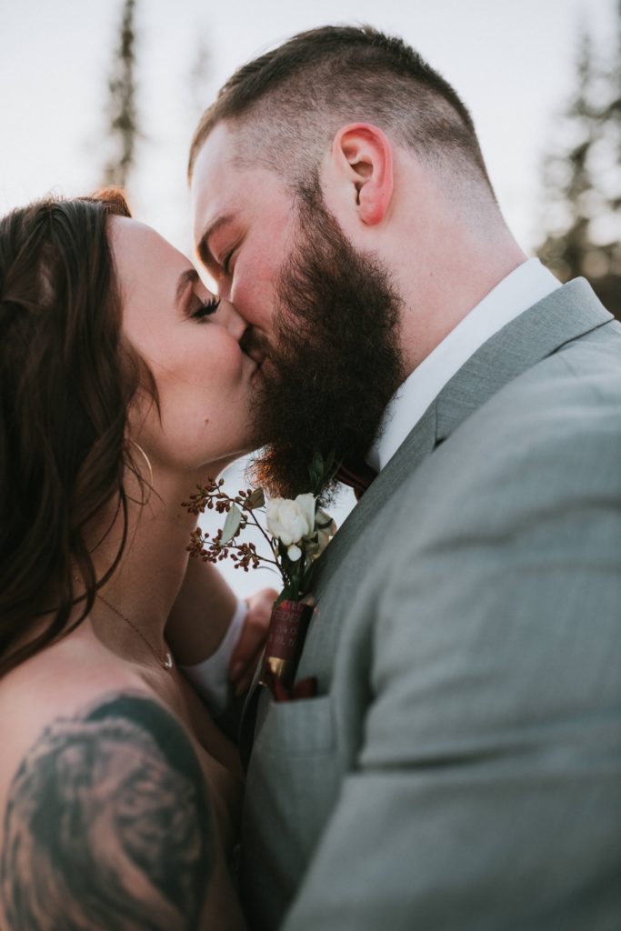 Detail photo of kiss at winter wedding
