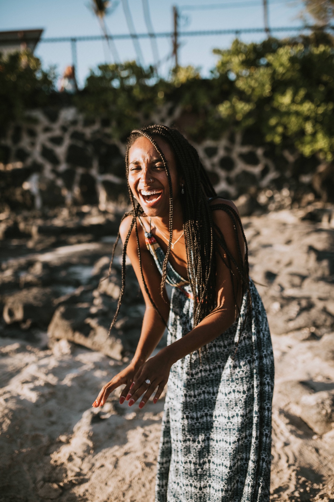 Girl laughing on beach in Hawaii