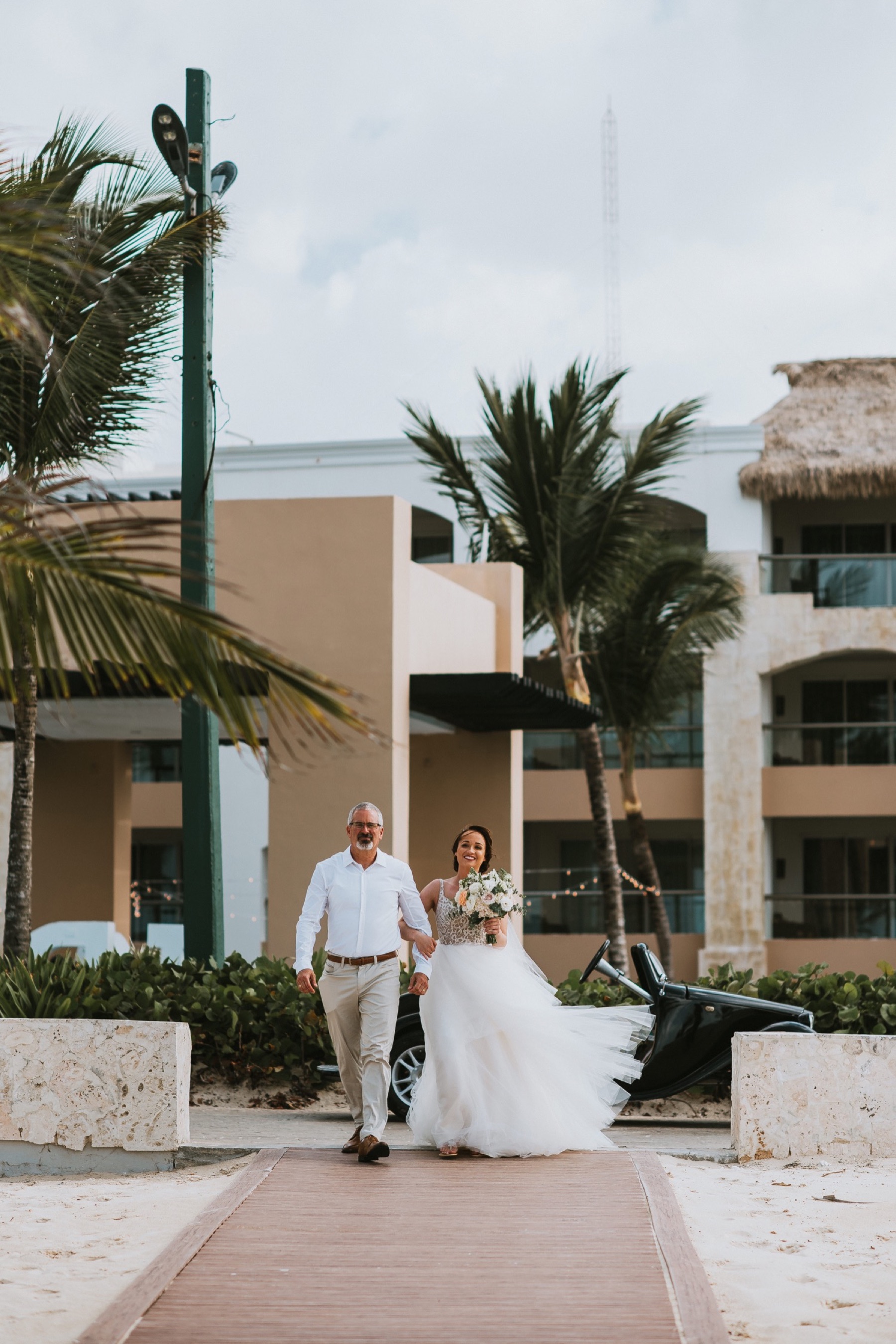 Bride being walked down the aisle at Hard Rock Punta Cana
