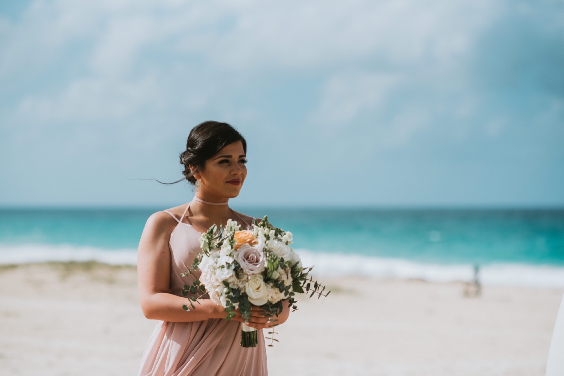 maid of honor smiling during ceremony on beach at Hard Rock Punta Cana