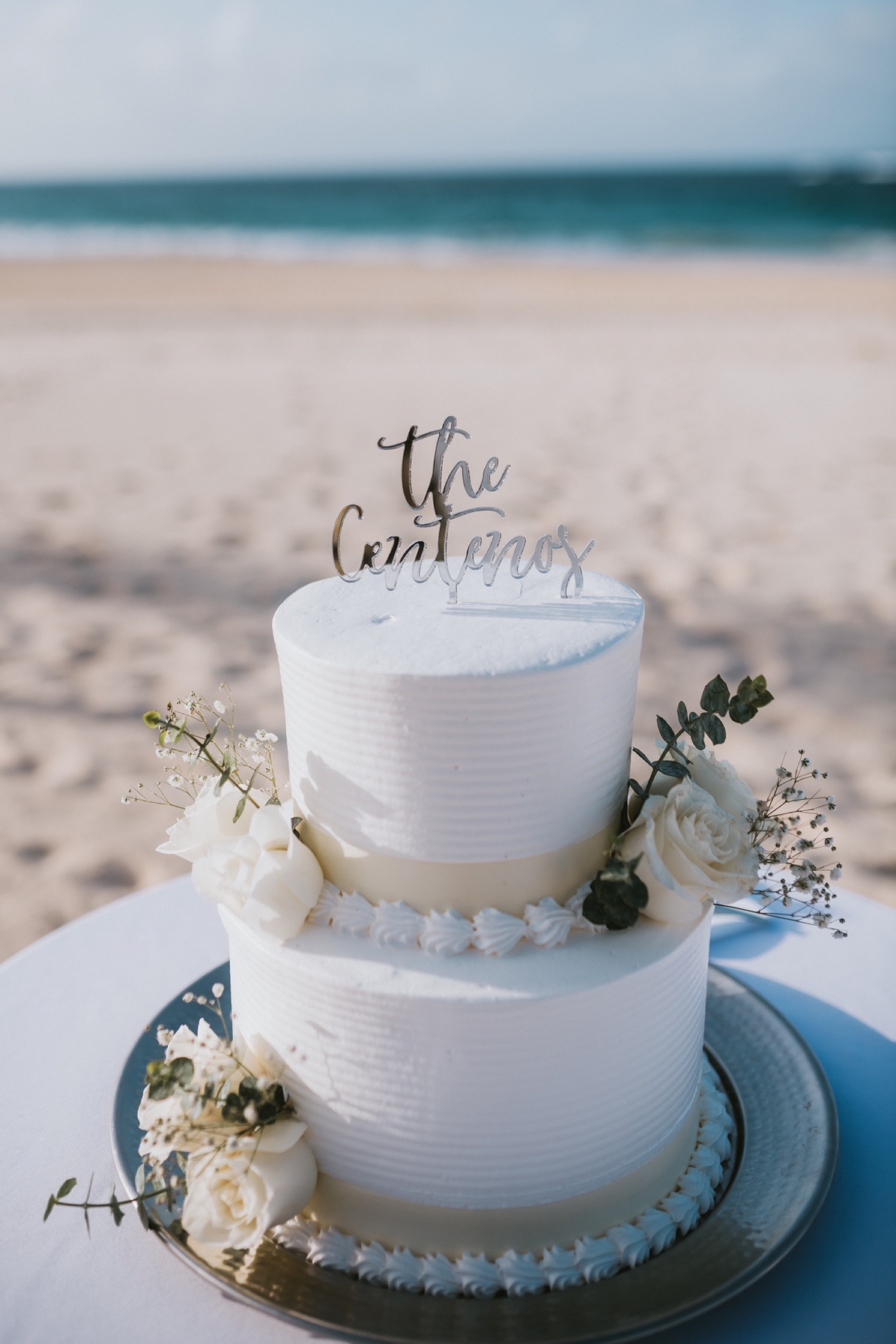 White wedding cake with flowers at hard rock punta cana