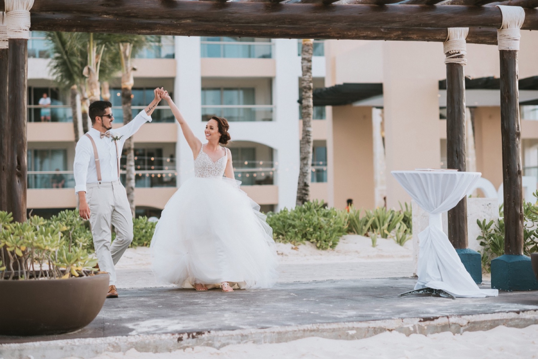 bride and groom dancing into reception