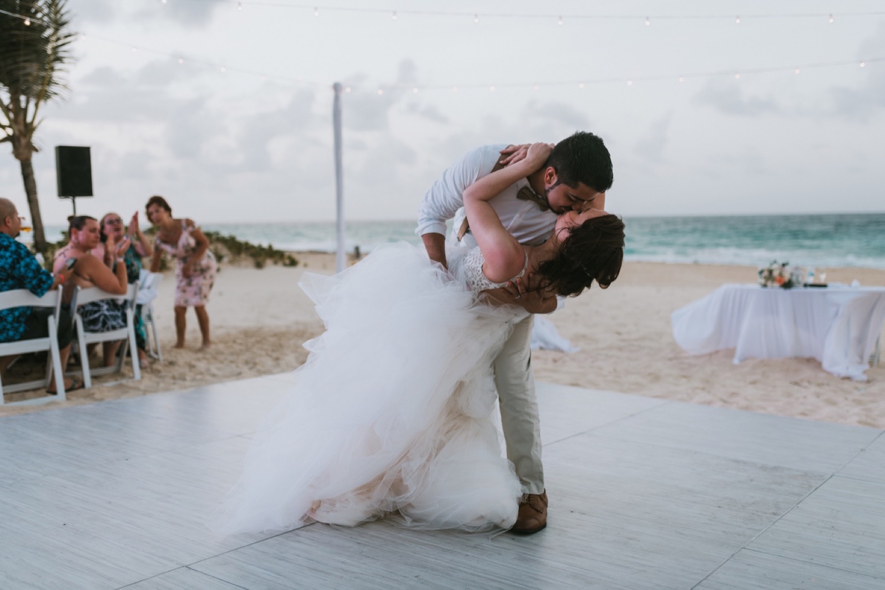 Couple dip kissing after first dance at hard rock punta cana