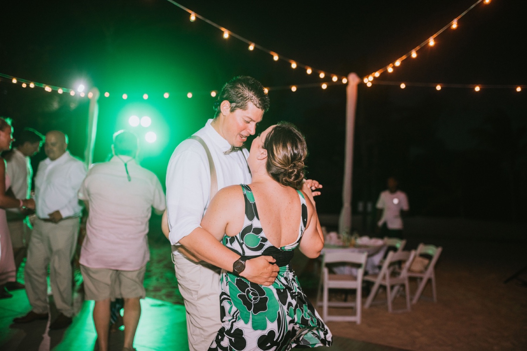 Best man dancing with wife at wedding