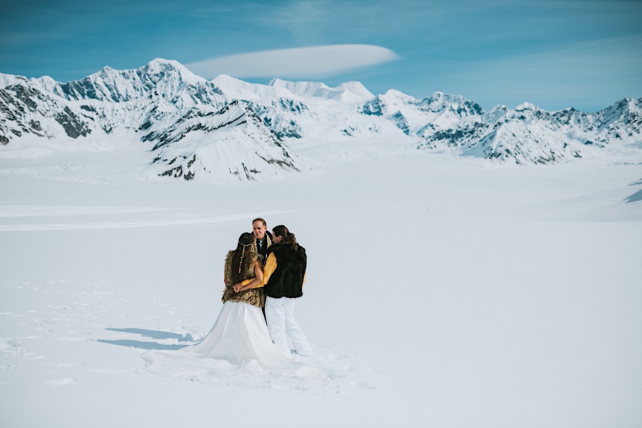 Couple hugging during their alaska glacier wedding in Denali