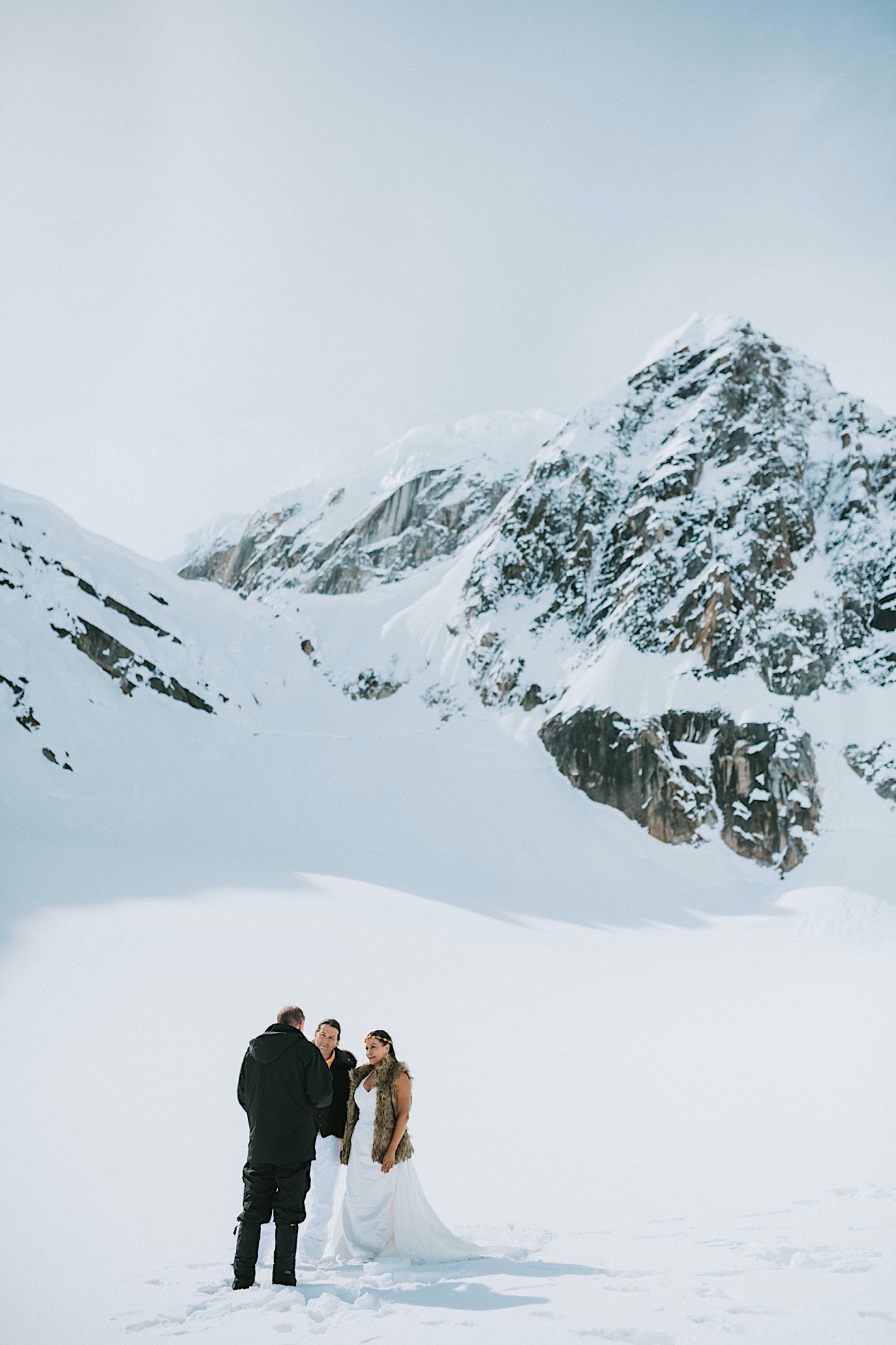 an Alaska glacier wedding being performed on Ruth Glacier