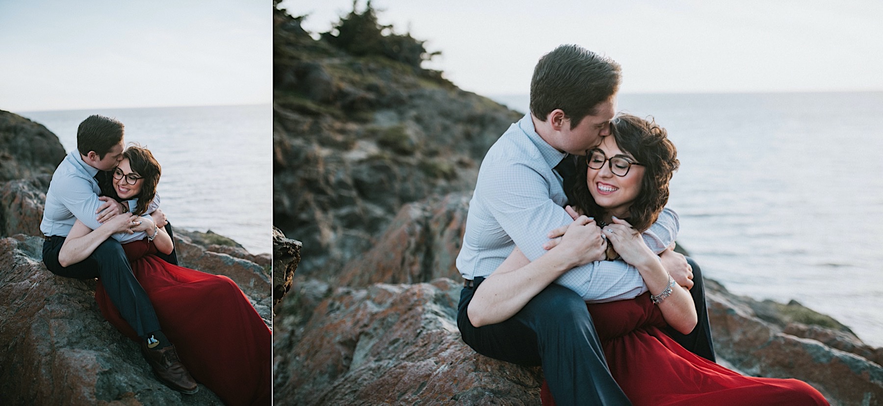A couple sitting on rocks at Beluga Point with ocean backdrop, he is wrapping her up in his arms