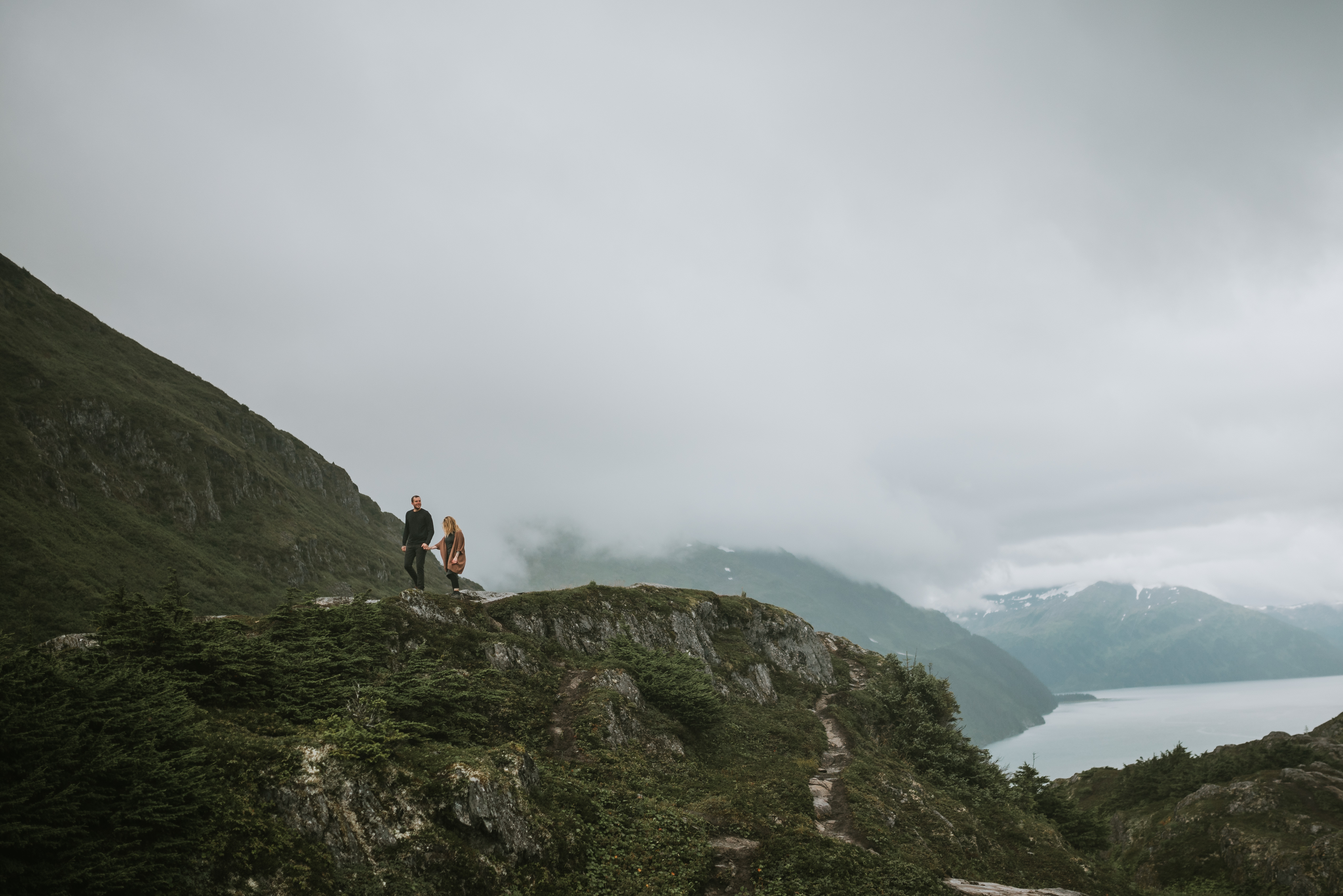 Portage engagement photos, couple hiking along ridge above Whittier, Alaska