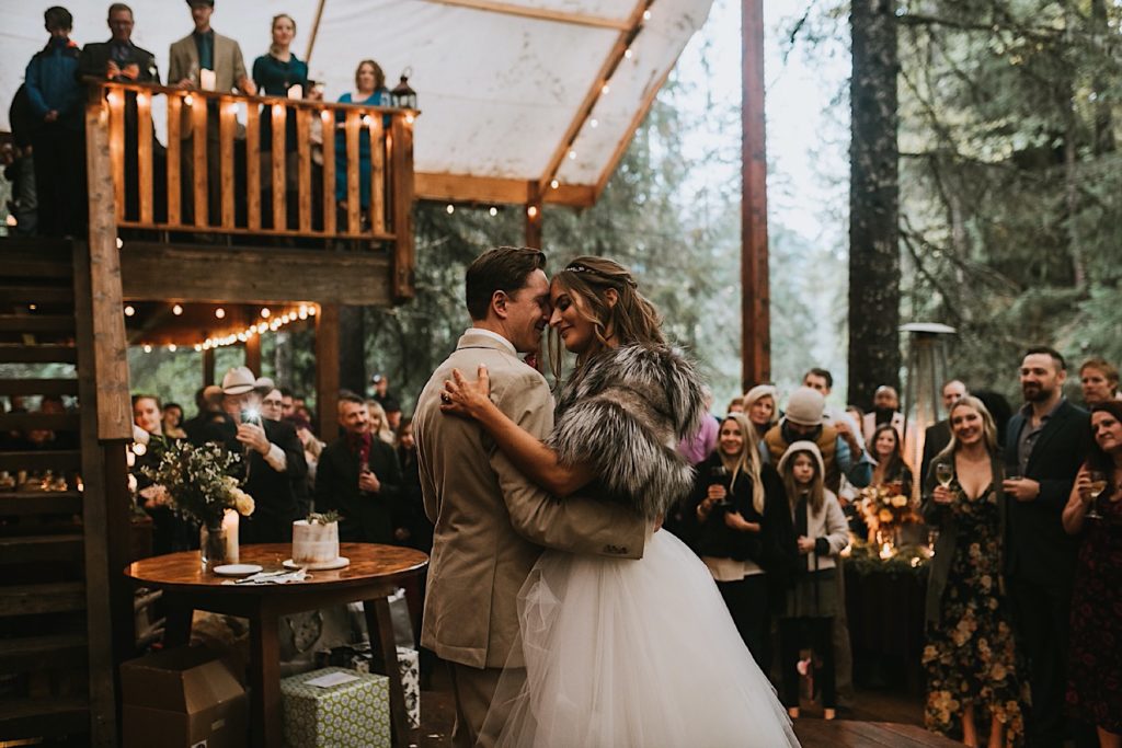 Bride and groom dancing during their wedding at raven glacier lodge
