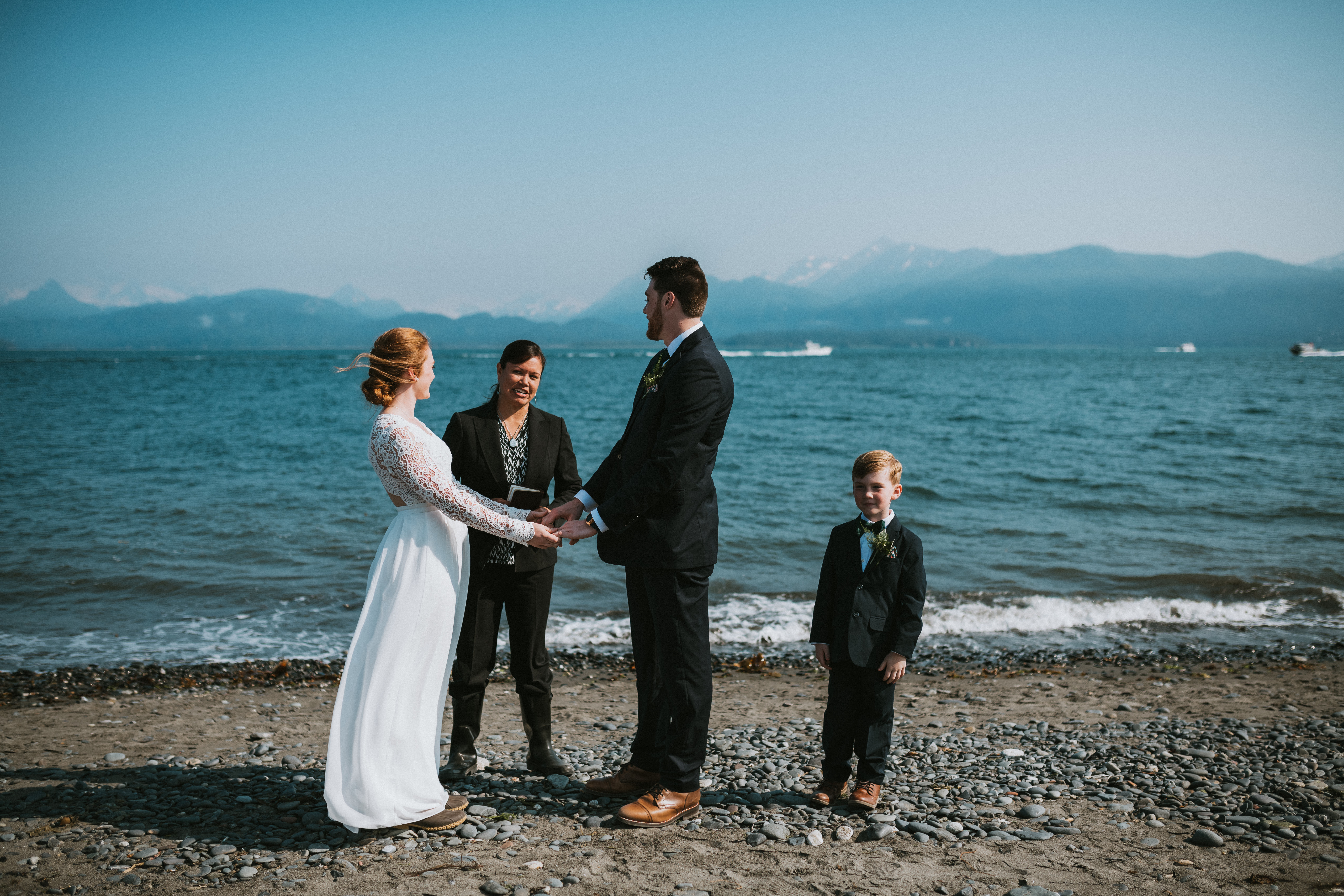 Bride and groom standing in front of each other during homer elopement 
