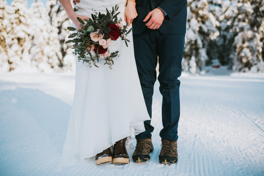 close up of couples shoes during winter elopement