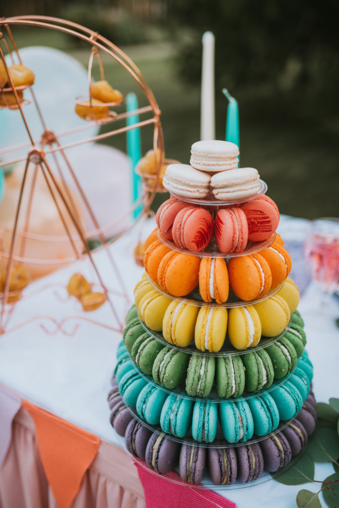 Rainbow colored macaron tower for alaska state fair elopement