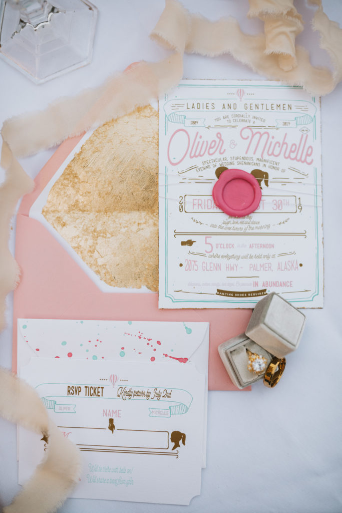 Pink and gold carnival theme invitation suite