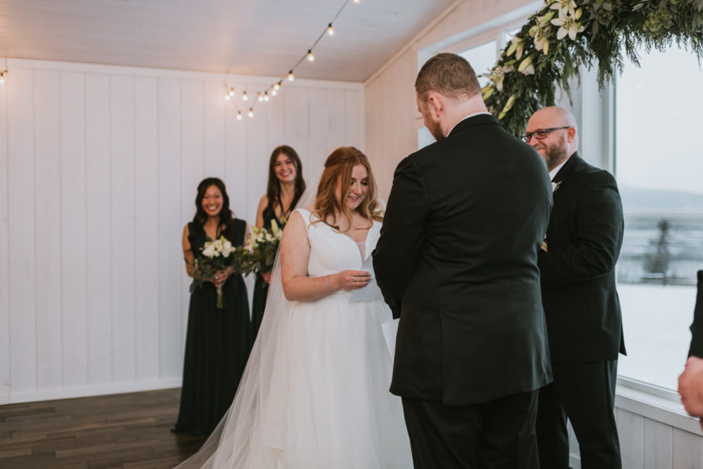 Bride reading her wedding vows to her husband during ceremony
