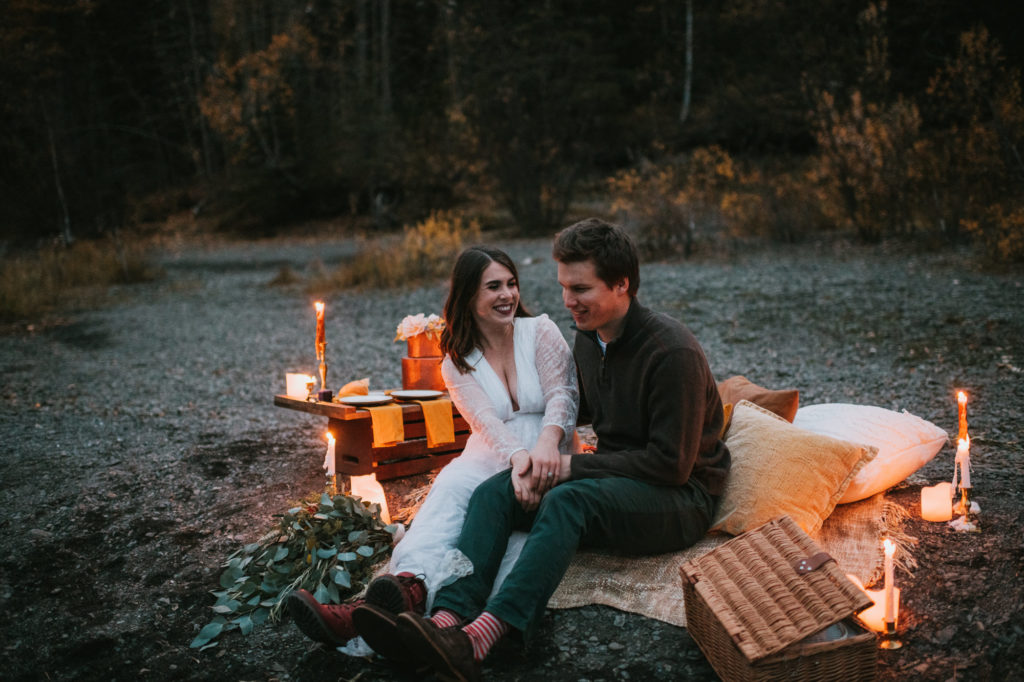Couple laughing together during elopement picnic
