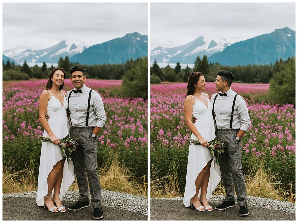 a couple kissing and snuggling in front of fireweed in juneau one of alaska coastal towns