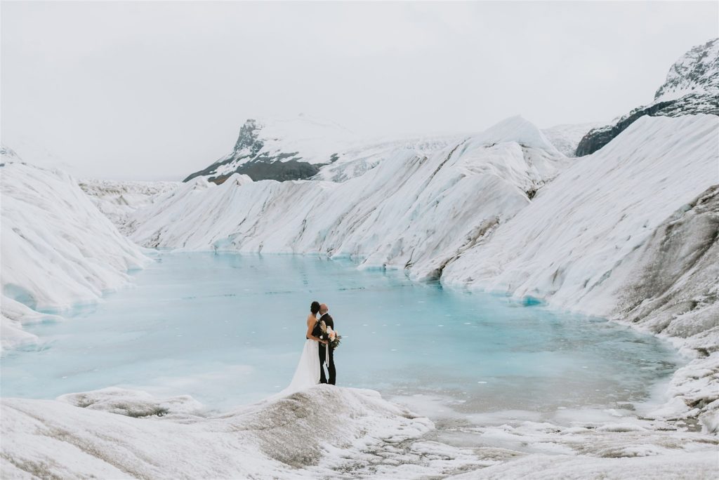 bride and groom portraits on a glacier